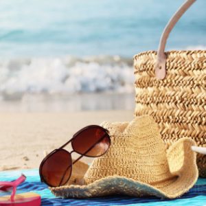 beach bag and sunglases on beach
